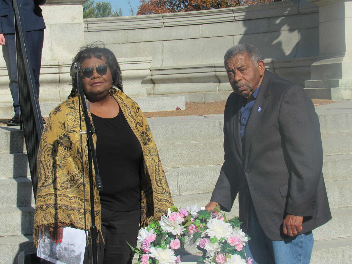 Bonnie Fox and Edmond Gray place a wreath during Wednesday's Elijah P. Lovejoy's memorial service in Alton.