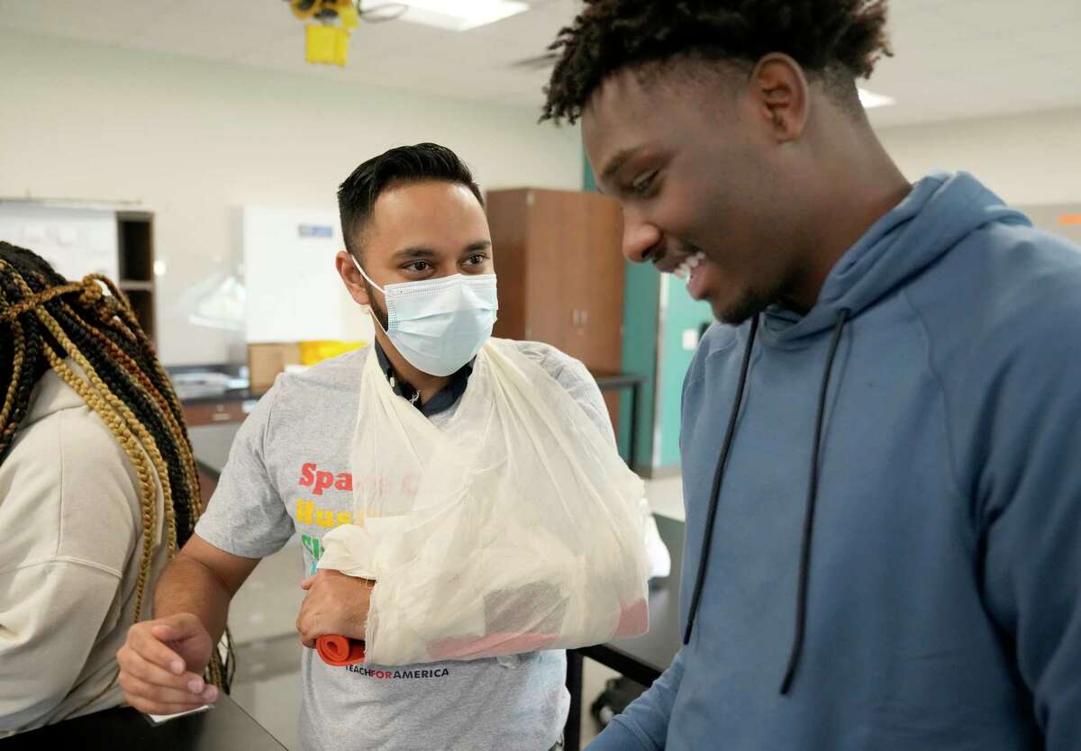 Nabeel Ahmad, a aesculapian  pupil  from the University of Houston College of Medicine, left, has Damion Lewis, a senior, right, use  a splint to his limb  Wednesday, Nov. 9, 2022, successful  Houston. In the Healthcare Collaborative, aesculapian  students service  arsenic  mentors to students who are funny   successful  pursuing a vocation  successful  wellness  sciences.