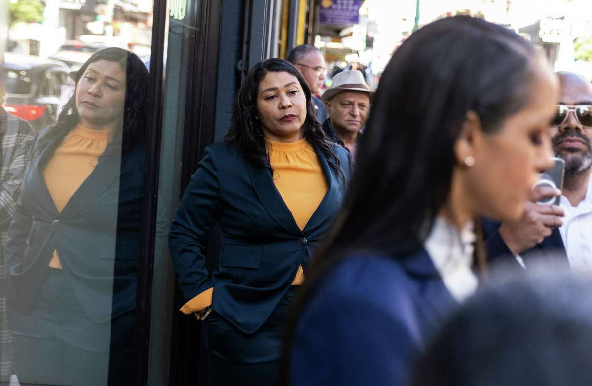 San Francisco Mayor London Breed watches as District Attorney Brooke Jenkins speaks during a press conference in the Chinatown neighborhood of San Francisco, California Wednesday , Nov. 9, 2022.