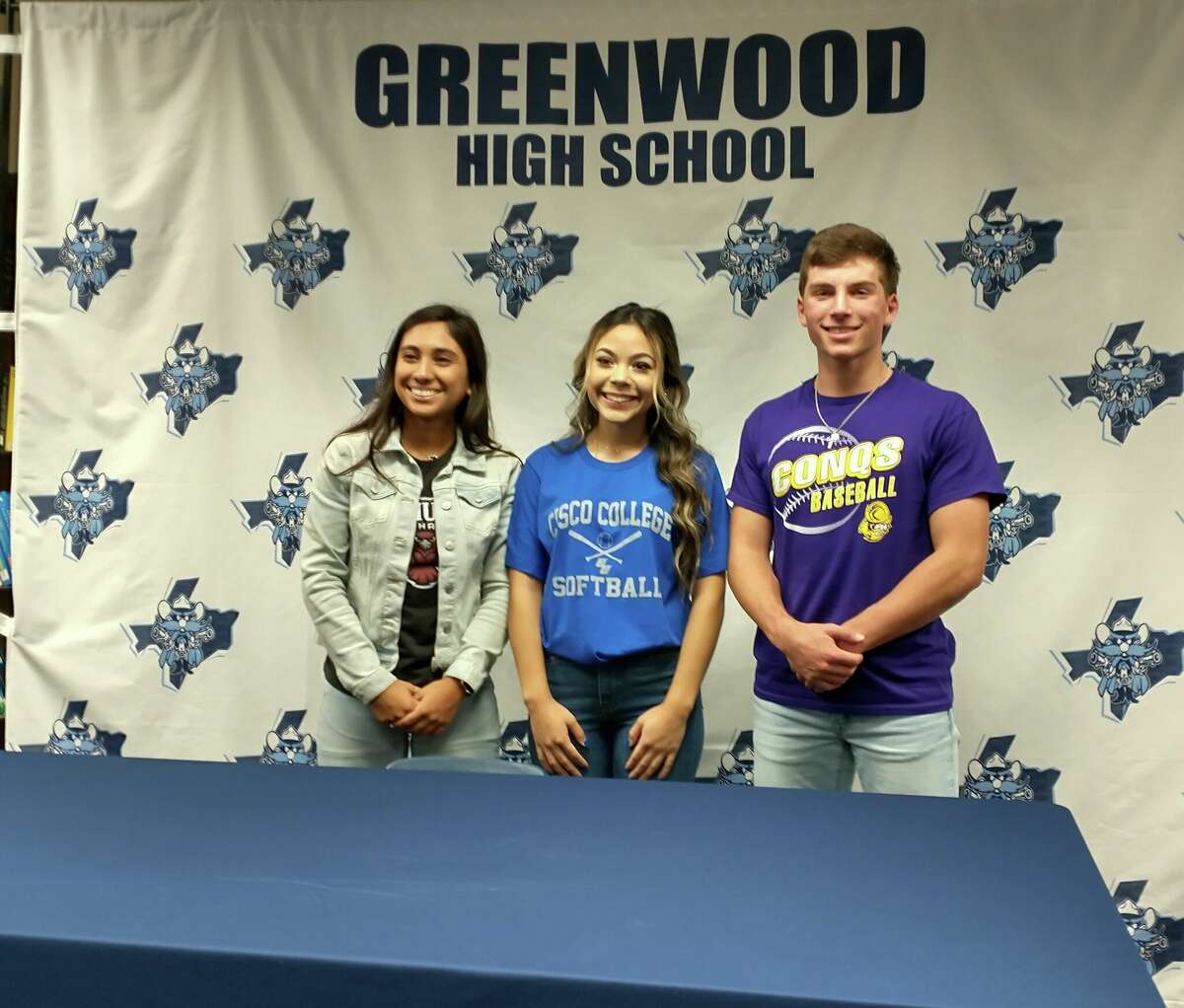 Greenwood student-athletes, from left, Jackie Ramirez (McMurry soccer), Addison Flores (Cisco College softball) and Rance Purser (Dodge City CC baseball, football) pose after signing with their respective colleges on 11/9/2022.