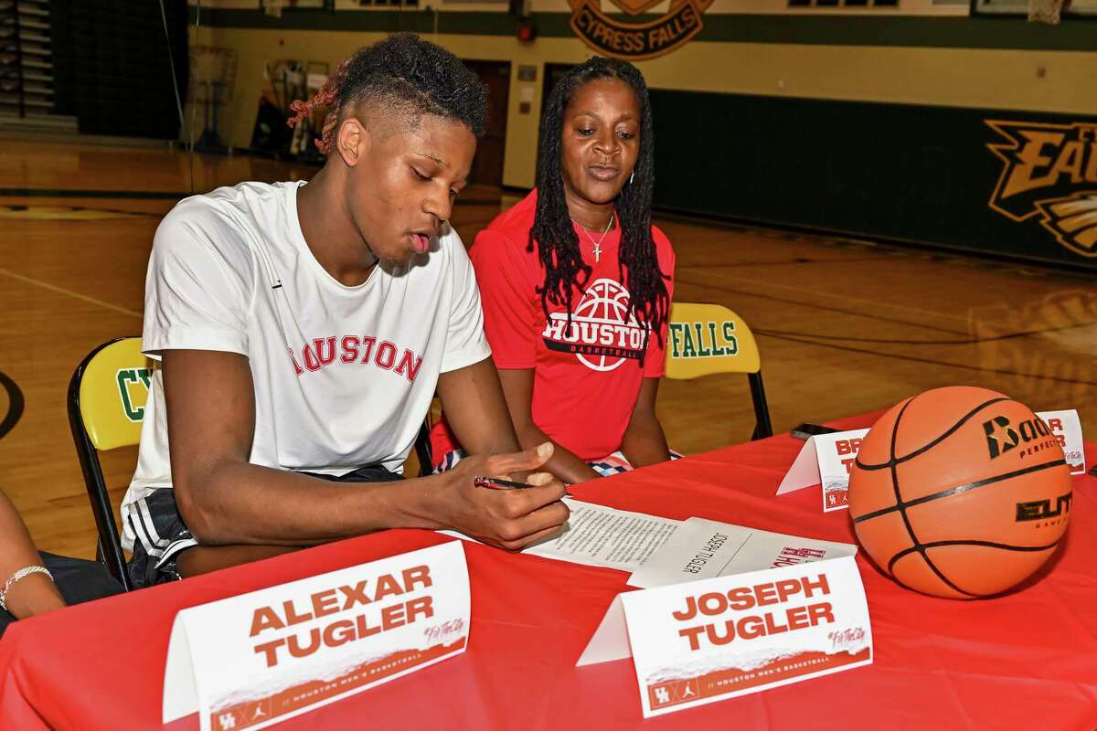 Cypress Falls High School class of 2023 basketball player Joseph Tugler signs his National Letter of Intent to play basketball at the University of Houston on November 9, 2022.
