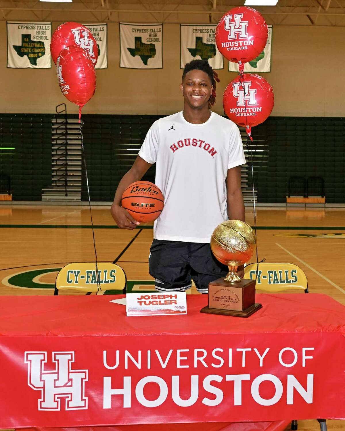 Cypress Falls High School class of 2023 basketball player Joseph Tugler poses after signing his National Letter of Intent to play basketball at the University of Houston on November 9, 2022.