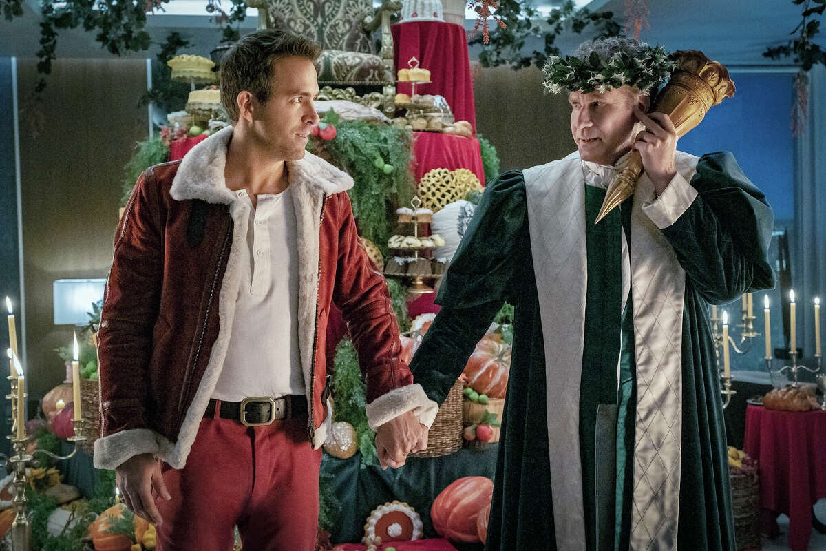Ryan Reynolds (left) and Will Ferrell star in the holiday musical "Spirited."
