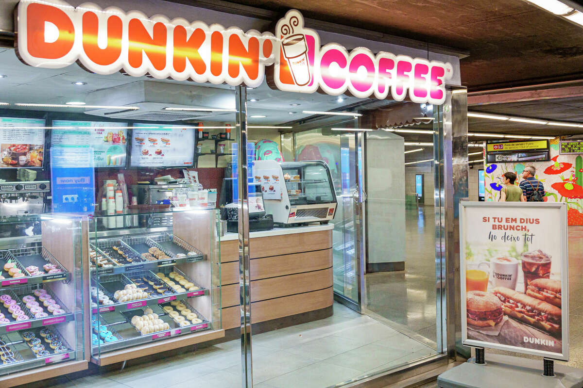 Barcelona, Dunkin' Coffee, caf_ in subway station. (Photo by: Jeffrey Greenberg/Universal Images Group via Getty Images)