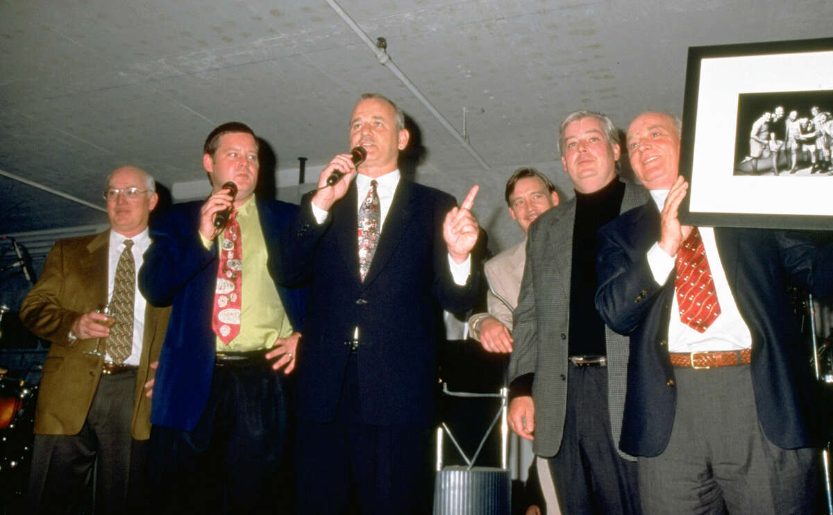 Andy Murray (second from right) and the rest of the Murray brothers — Ed (from left), Joel, Bill, John and Brian — auction a photo of themselves during a late-1990s benefit for Paul Newman's Hole-In-The-Wall Gang camp for kids with cancer. After years as a working cook, Andy Murray has written a cookbook.