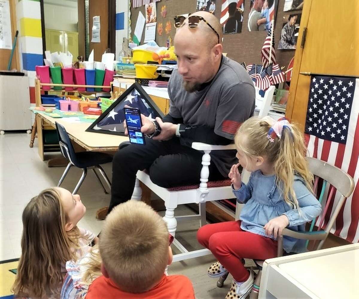 U.S. Air Force veteran Dan Broadbent talks to Trinity Lutheran preschool students Thursday in Lynne Gatz's classroom.