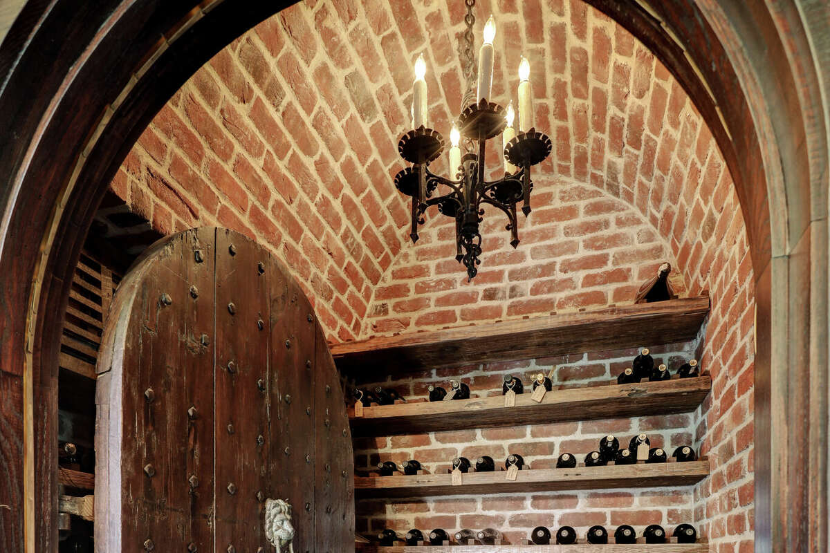 The wet bar has an adjacent climate-controlled wine room that holds 360 bottles.