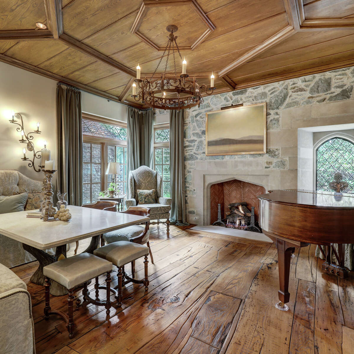 A fireplace with limestone surround is in the music room.