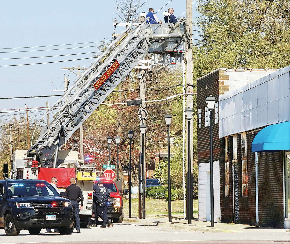 John Badman|The Telegraph Building inspectors in Wood River received a little help from the fire department this week with a few building inspections in the downtown area. Firefighters gave an inspector a ride in the bucket of their ladder truck so they could photograph and document the conditions of buildings on Ferguson Avenue and some streets just off Ferguson Avenue.