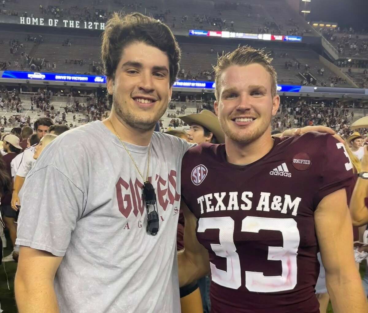 Lifelong friends Stavros Karamitsos, left, and Sam Mathews used to attend tailgates at Texas A&M games together  — before Mathews walked on and made the Aggies' roster.  Here, Karamitsos joined Mathews on the field last year after A&M upset top-ranked Alabama.