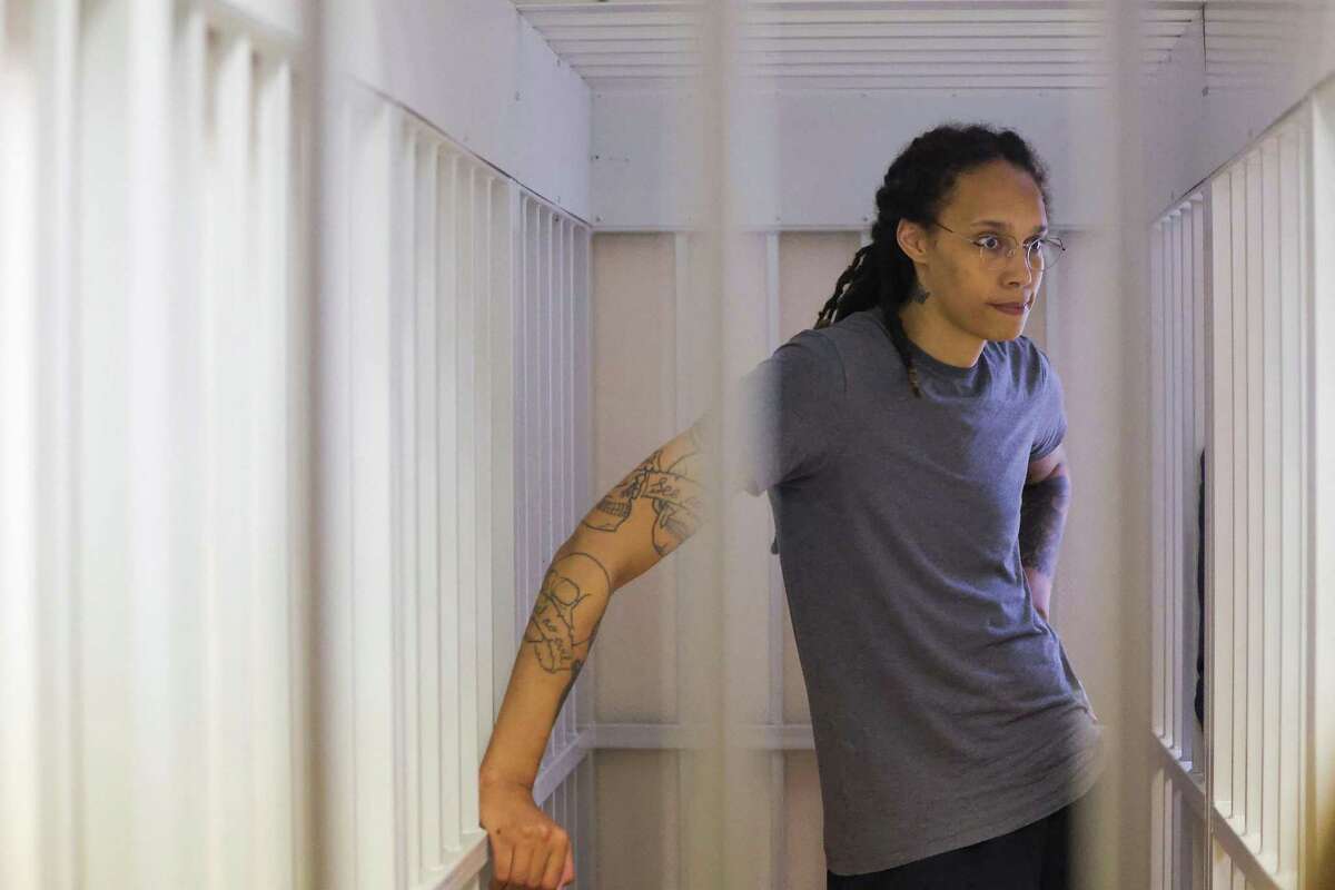 U.S. Women's National Basketball Association basketball player Brittney Griner, who was detained at Moscow's Sheremetyevo airport and later charged with illegal possession of cannabis, waits for the verdict inside a defendants' cage during a hearing in Khimki outside Moscow, on Thursday, Aug. 4, 2022. (Evgenia Novozhenina/Pool/AFP/Getty Images/TNS)