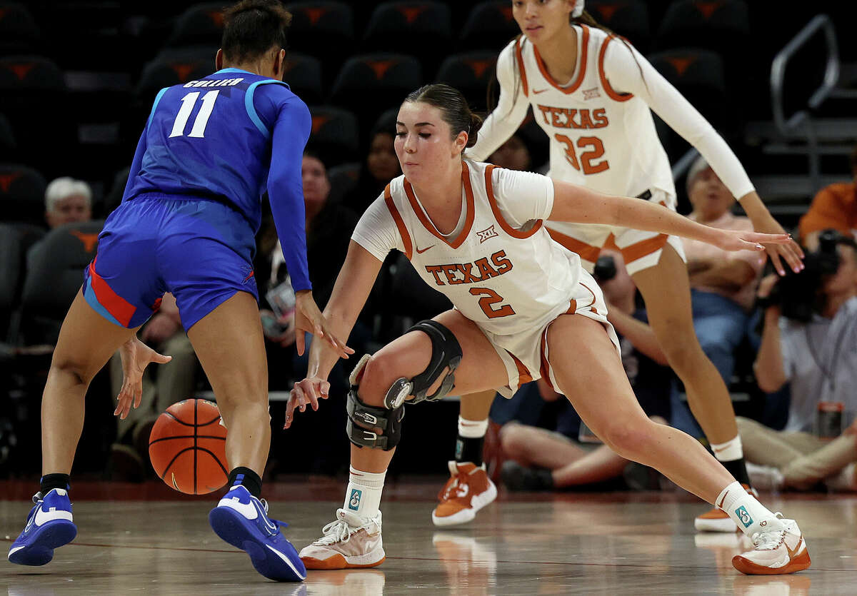 AUSTIN, TEXAS - OCTOBER 29: Shaylee Gonzales #2 of the Texas Longhorns plays defense against Kierra Collier #11 of the DePaul Blue Demons during an exhibition game between the Arkansas Razorbacks and the Texas Longhorns at Moody Center on October 29, 2022 in Austin, Texas. (Photo by Chris Covatta/Getty Images)