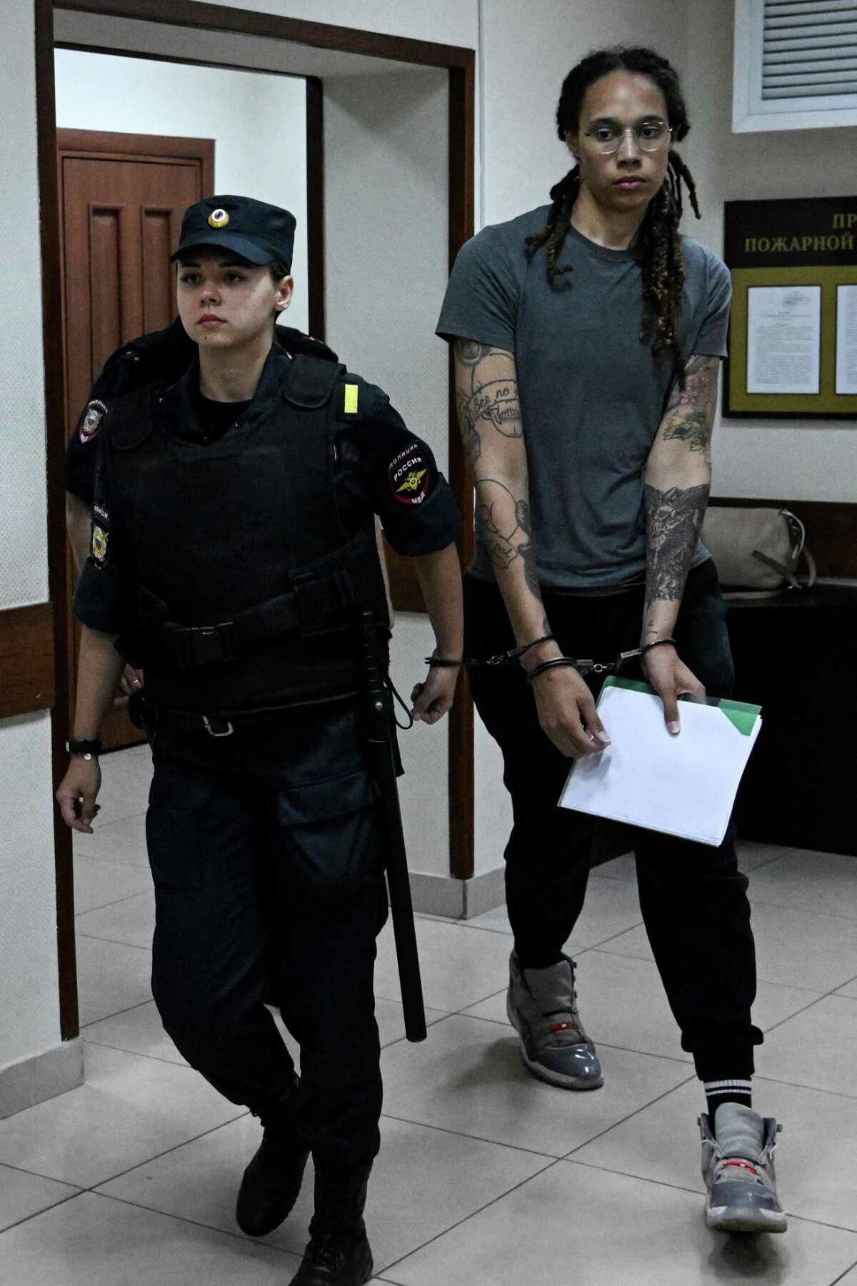 US Women's National Basketball Association (WNBA) basketball player Brittney Griner, who was detained at Moscow's Sheremetyevo airport and later charged with illegal possession of cannabis, leaves the courtroom after the court's verdict in Khimki outside Moscow, on August 4, 2022. - A Russian court found Griner guilty of smuggling and storing narcotics after prosecutors requested a sentence of nine and a half years in jail for the athlete. (Photo by Kirill KUDRYAVTSEV / AFP) (Photo by KIRILL KUDRYAVTSEV/AFP via Getty Images)