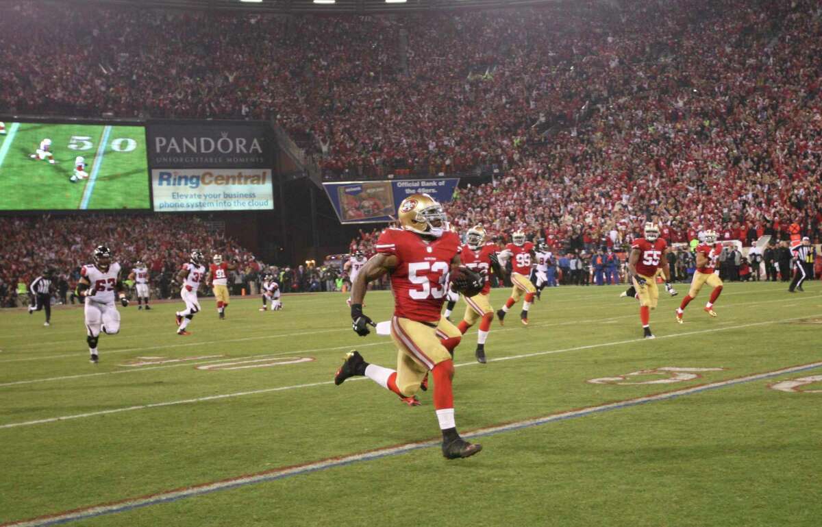 SAN FRANCISCO, CA - DECEMBER 23: NaVorro Bowman #53 of the San Francisco 49ers returns an interception 89-yards for a touchdown during the game against the Atlanta Falcons at Candlestick Park on December 23, 2013 in San Francisco, California. The 49ers defeated the Falcons 34-24. (Photo by Michael Zagaris/San Francisco 49ers/Getty Images)