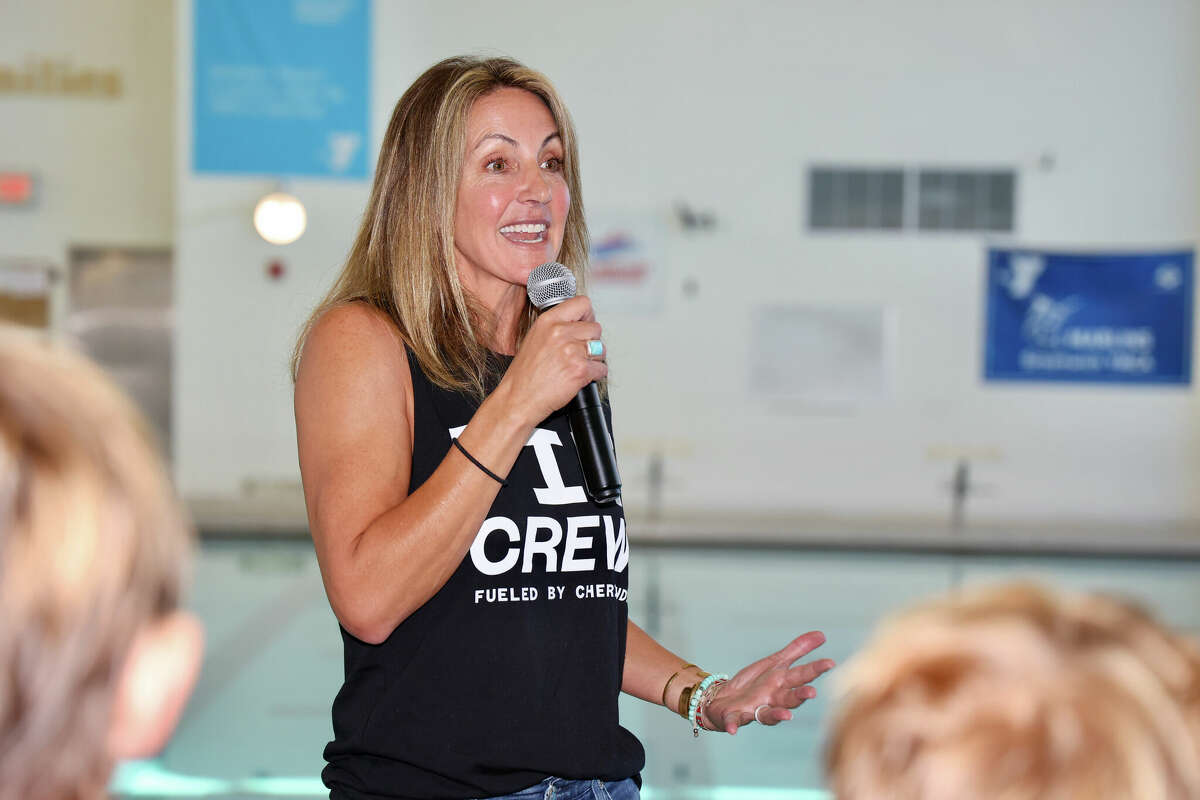 Olympic gold medalist Summer Sanders attends the recent ribbon-cutting ceremony for the new 34-foot scoreboard at the YMCA of Greenwich. The new scoreboard is sponsored by Cheribundi, which donated $130,000 to the YMCA of Greenwich to fund the scoreboard as part of their Fueling Future Champions initiative.