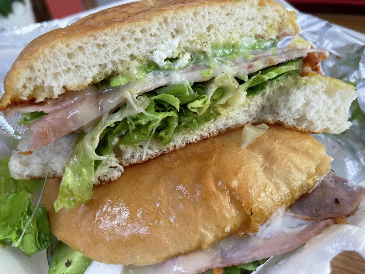 The Traditional sandwich at Que Tortas! has ham and a creamy cheese spread finish.