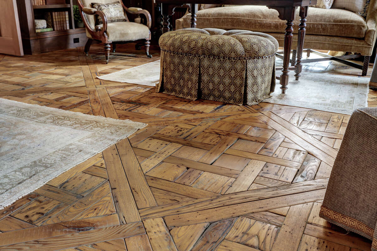 A close up look at the hand-beveled American chestnut flooring in the library.