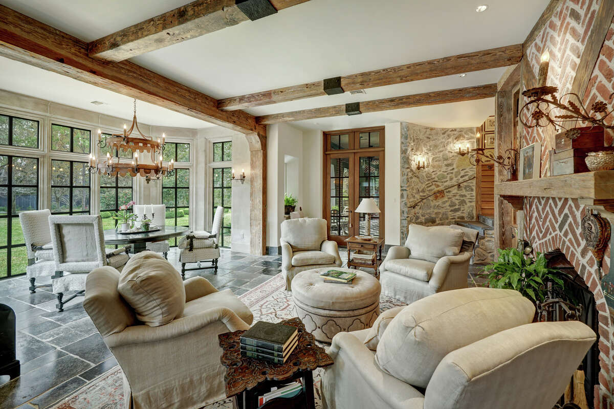 Adjacent to the kitchen is a sitting room and dining room.