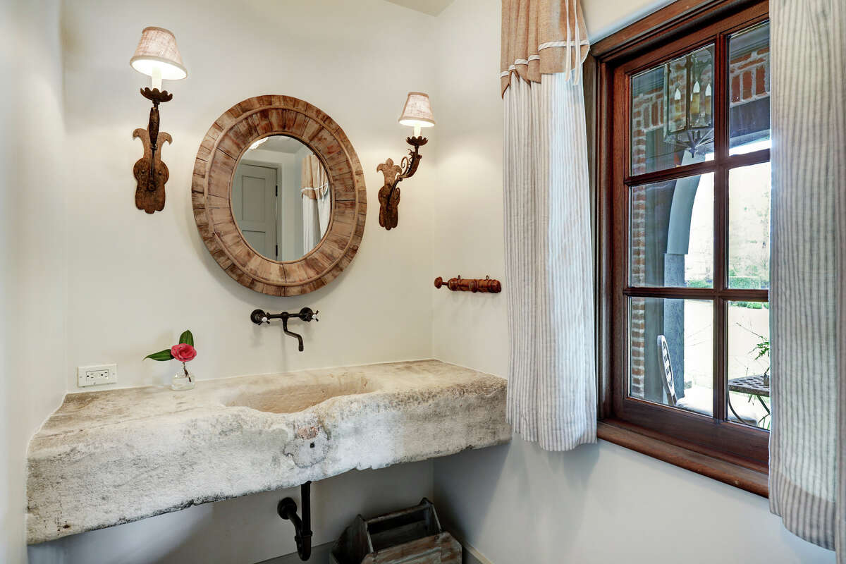 The home has four full bathrooms and three half bathrooms.