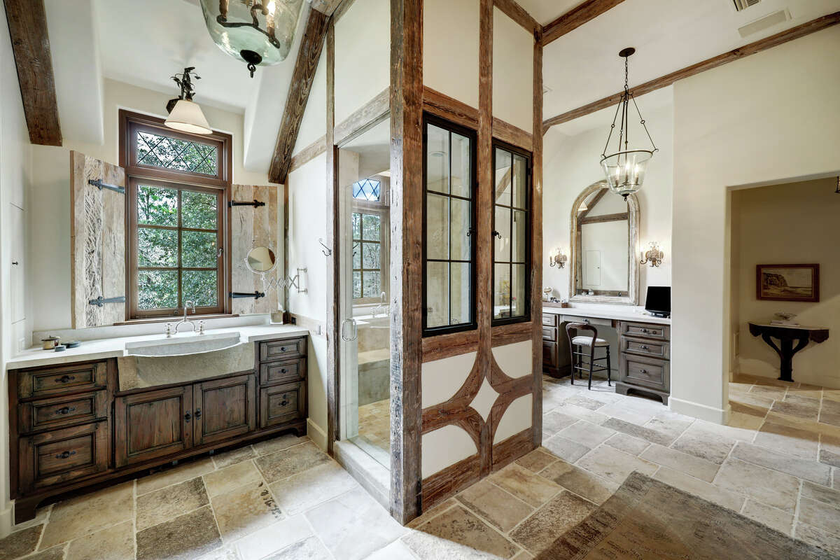 The primary ensuite has antique trough sinks.