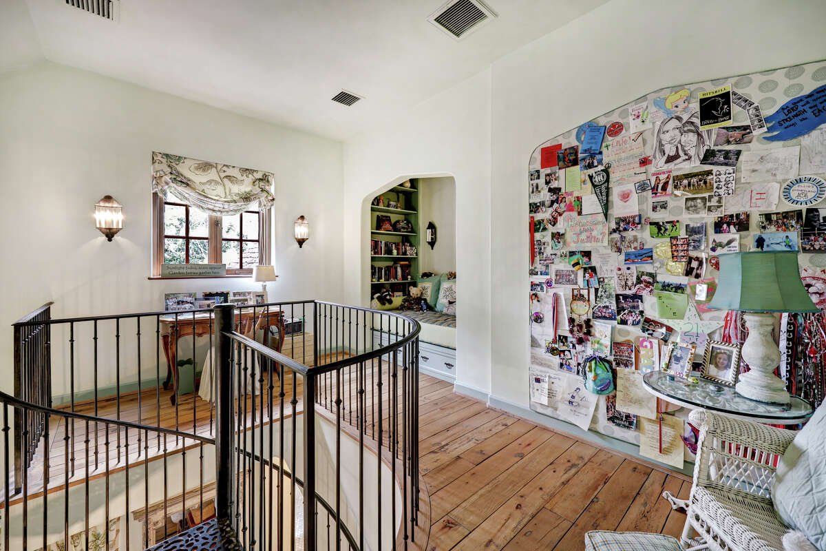 Two guest bedrooms include a loft area with a built-in reading nook.