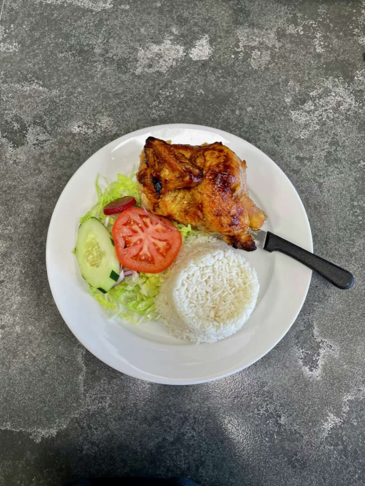 Pollo a la brasa with salad and rice at Fiesta Westside in Stamford