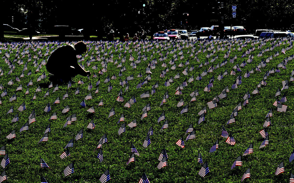 File: American flags planted in Washington D.C. in 2018, each representing a veteran or a service member who died by suicide that year. 