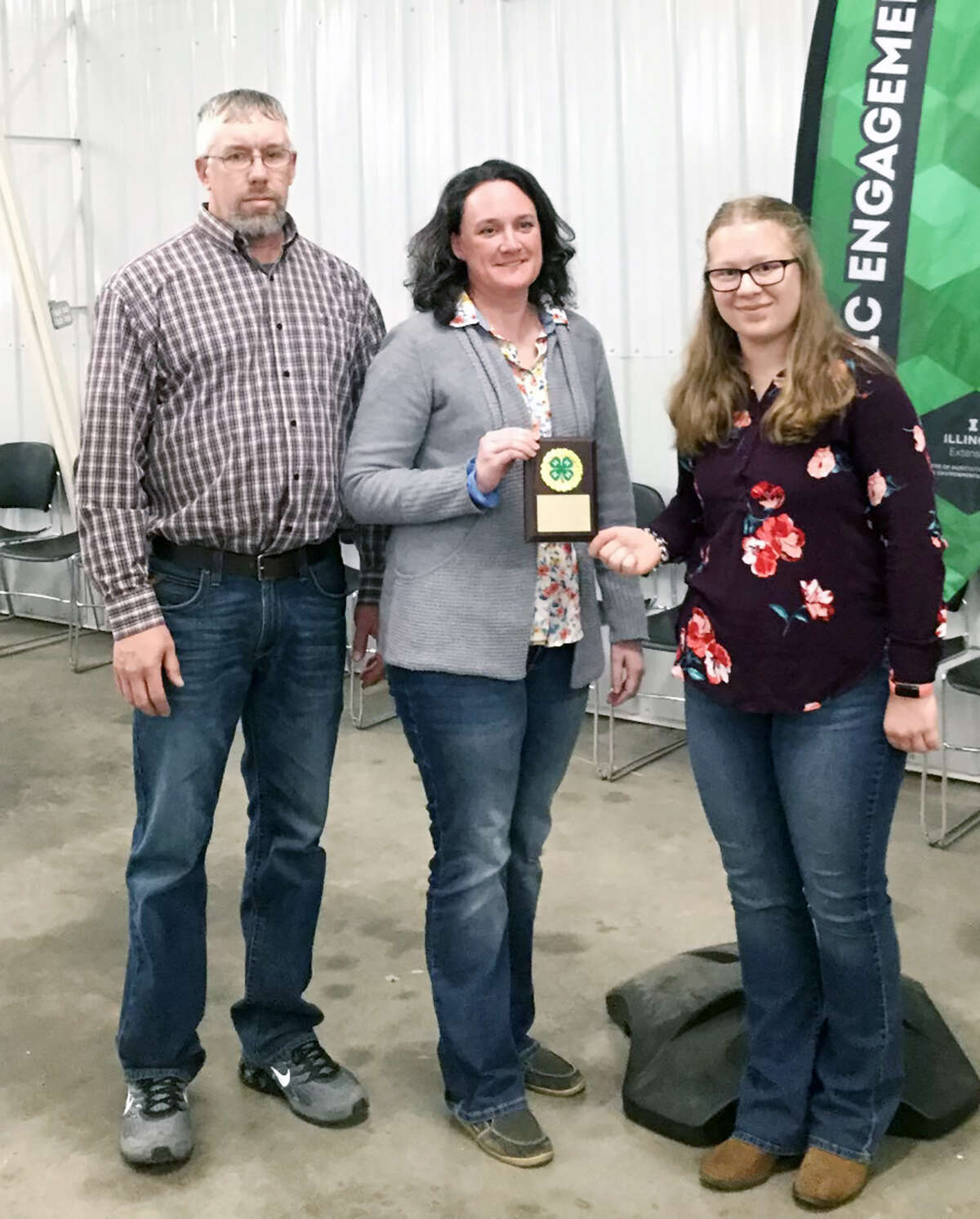 Morgan County 4-H recently held its 78th annual Achievement Night, during which Savanna Ford (right) presented Jeremy and Abby Walker with the Friend of 4-H Award.