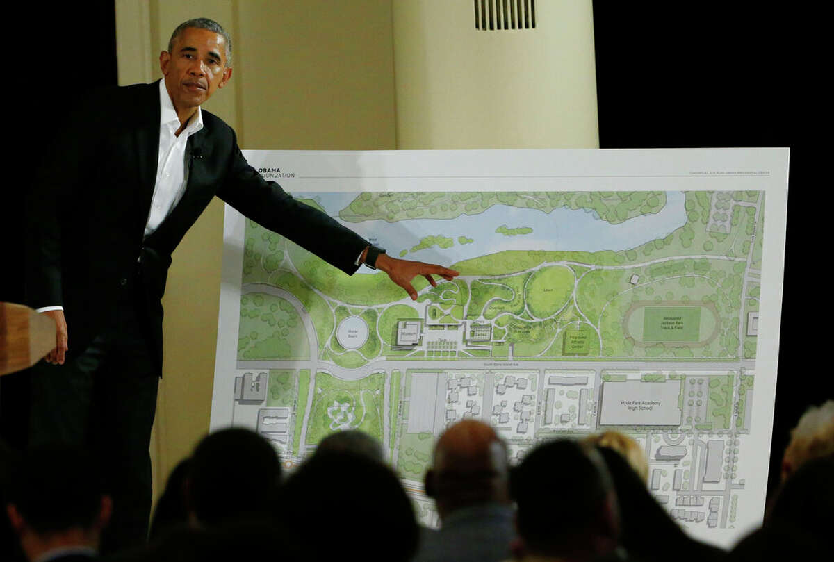 Former President Barack Obama points to a rendering for the former president's lakefront presidential center at a community event in Chicago in 2017.
