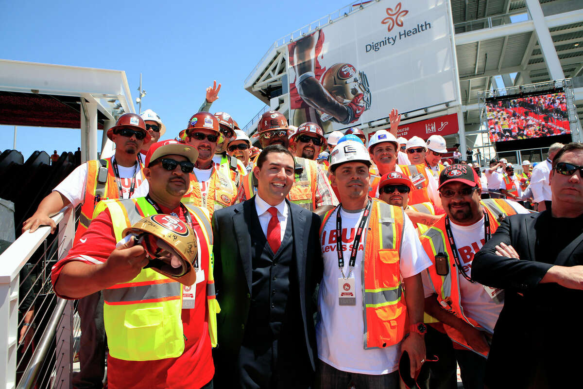 49ers CEO Jed York celebrates the opening of Levi’s Stadium in Santa Clara with construction workers who built it. The team made nearly $4.6 million in donations to Santa Clara political candidates, an unusually high amount for a local election.