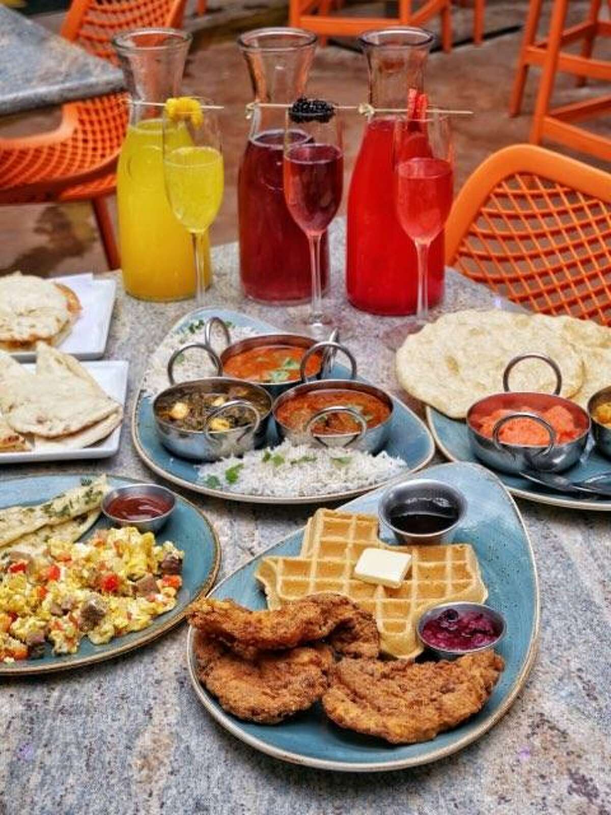 An assortment of brunch foods available at Cowboys & Indians, a fusion restaurant in Houston's Heights.