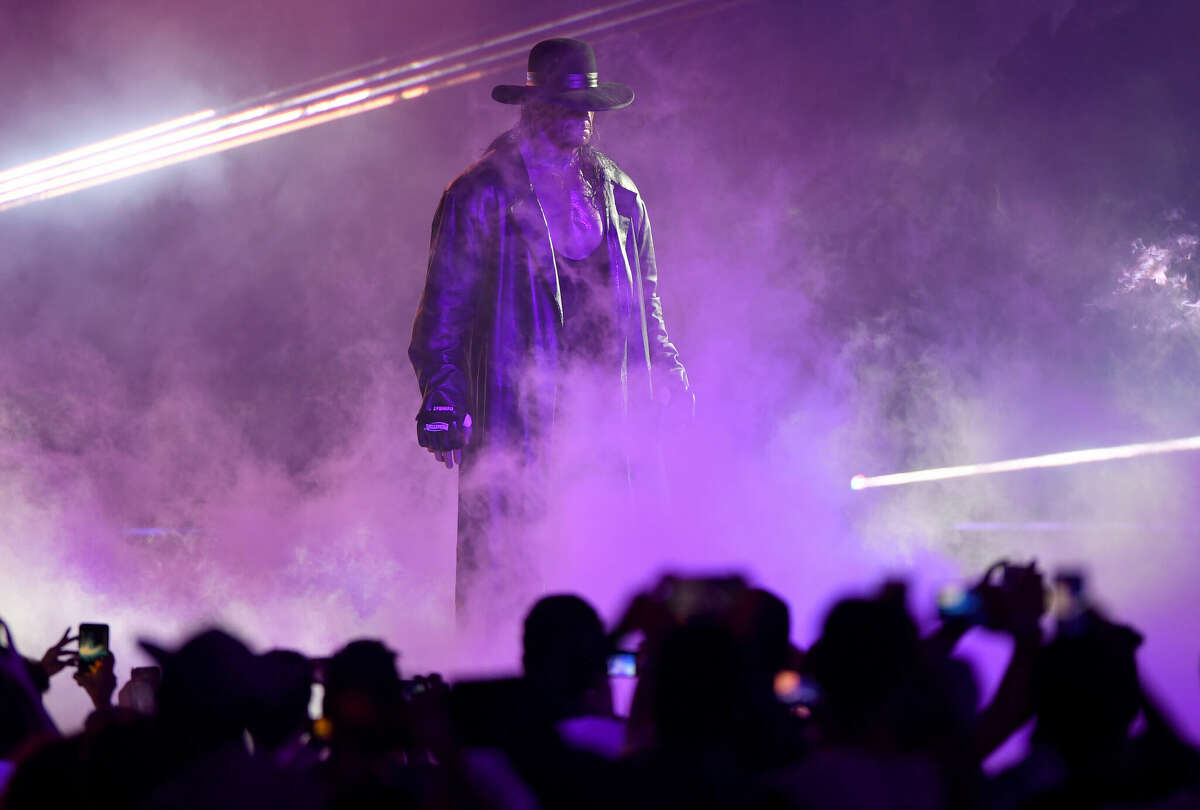 World Wrestling Entertainment star The Undertaker makes his way to the ring during a match at the World Wrestling Entertainment (WWE) Super Showdown event in the Saudi Red Sea port city of Jeddah late on January 7, 2019.