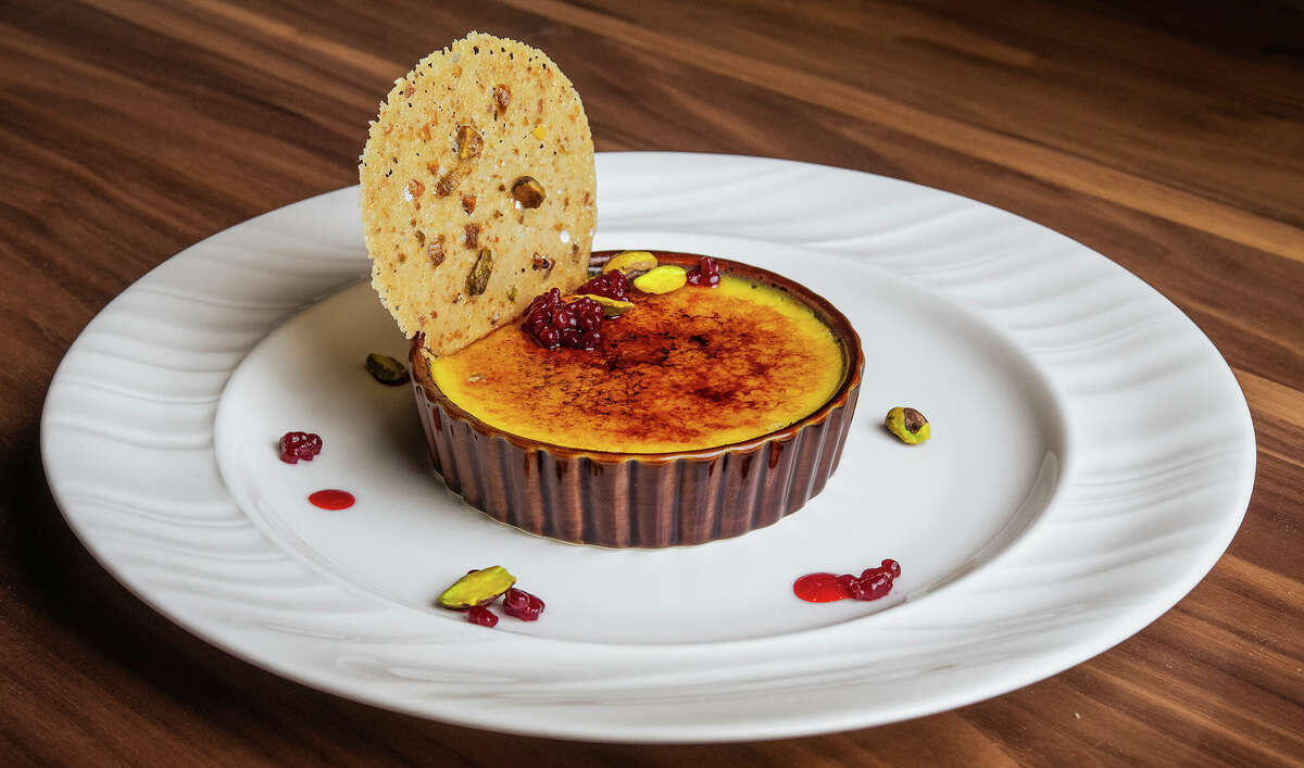 Creme brulee at the new Scarlet Knife restaurant in Latham has flavors of pistachio and raspberry. The pastry chef is Jenny Carter.