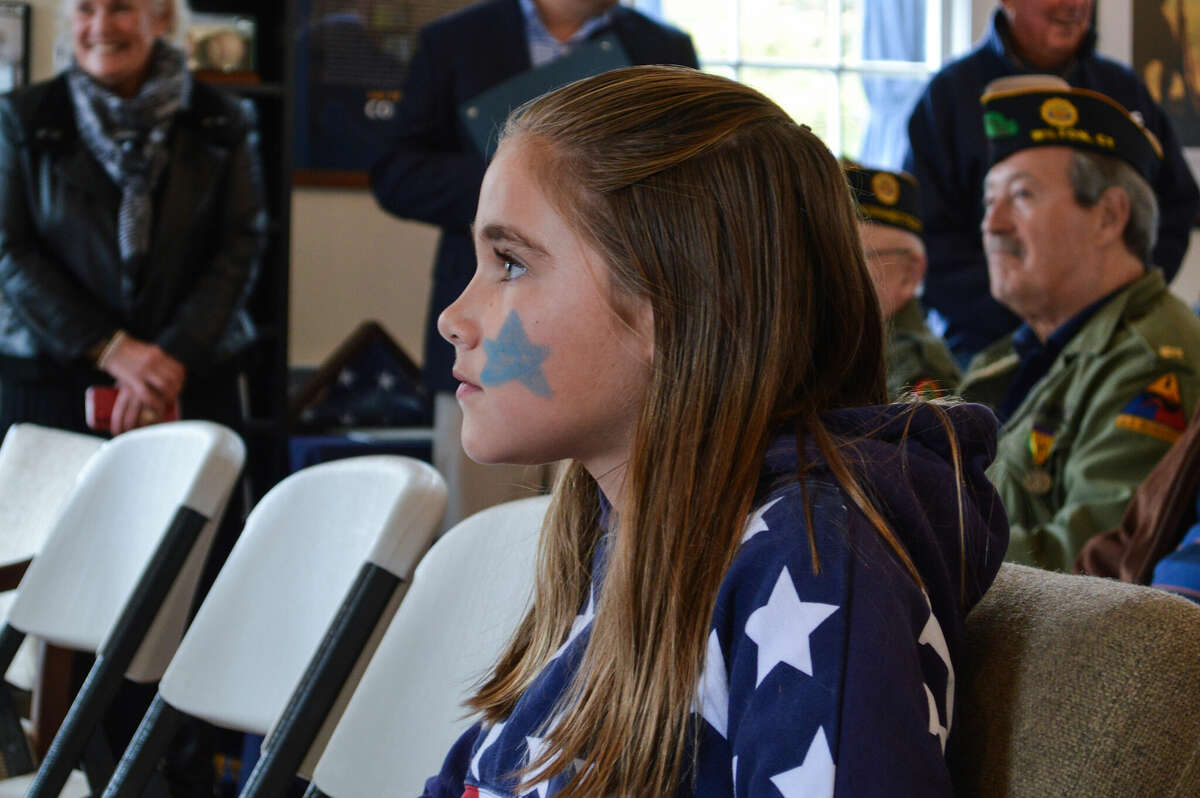 Essay-contest winner Elyse Pencu, 11, of Wilton waits for the ceremony to start.