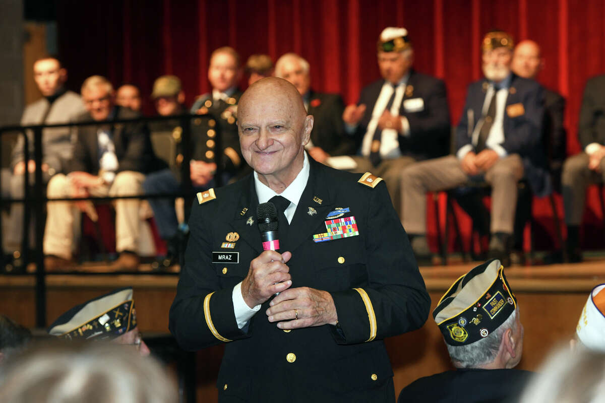 U.S. Army veteran Bob Mraz introduces himself to students during Veterans Day question and answer presentation at Trumbull High School, in Trumbull, Conn. Nov. 11, 2022.