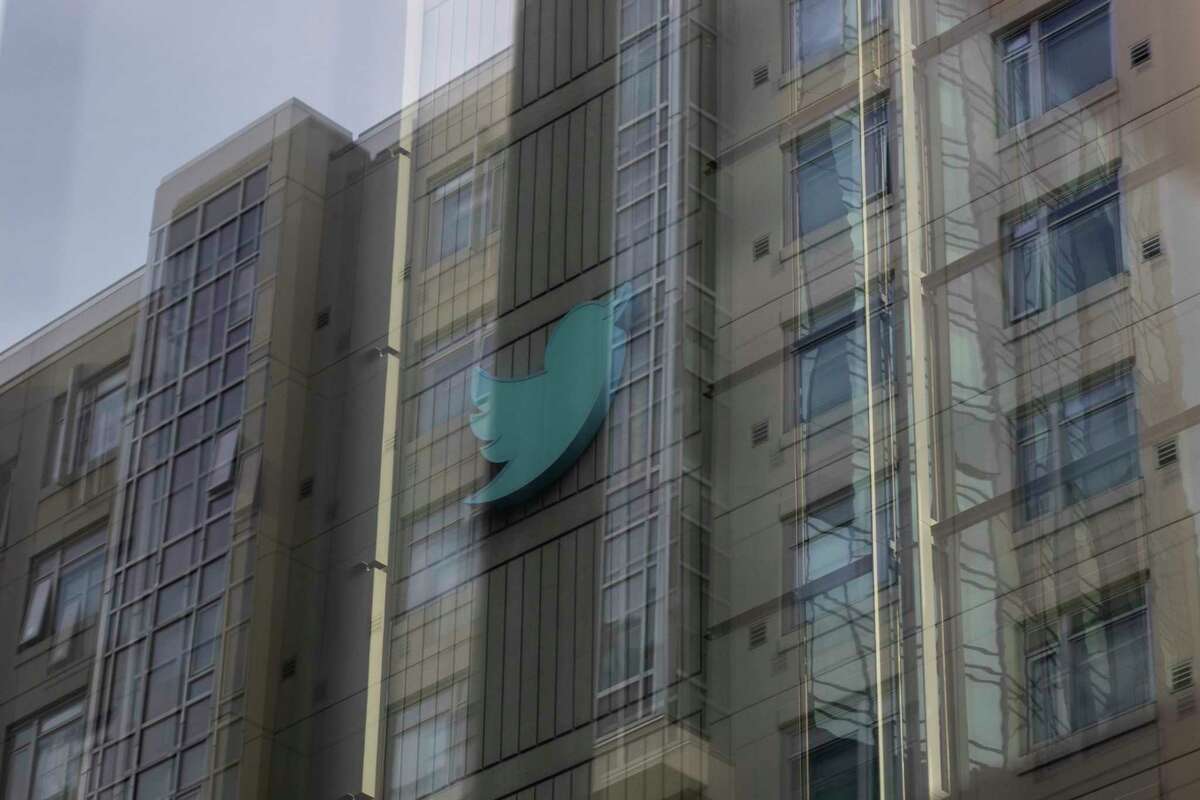The Twitter logo is seen at Twitter headquarters on Friday morning. The San Francisco-based social platform, under the leadership of new owner Elon Musk, has announced its immediate plan for its employees to end remote work and return to the office.