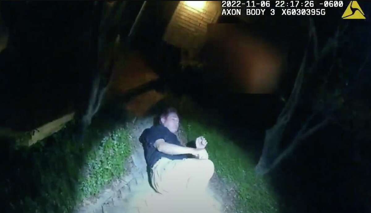 Screen grabs from the body camera of a responding SAPD officer. The video is labeled Critical Incident Video Release of Hit & Run Investigation on 11/6/22 and shows San Antonio City Council member Clayton Perry in his back yard on November 6, 2022.