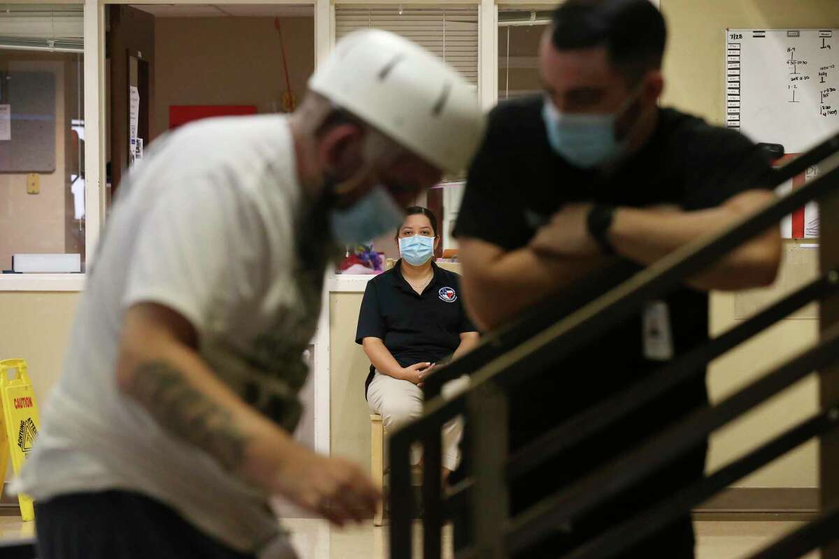Elizabeth Guajardo watches as her husband, Joe Angel Garcia, 43 struggles to climb a set of steps at Warm Springs Rehabilitation Hospital. Garcia, 43, suffered severe brain, spinal and other injuries after a drunken driver drove a three-ton Lincoln Navigator into his motorcycle on Sept. 19, 2021. “He’s not the same Joe and never will be,” Guajardo said.