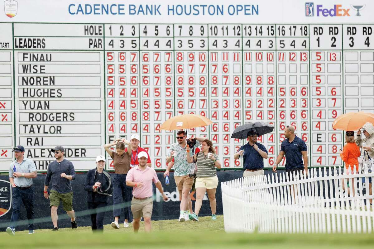 Fans leave after play is suspended for the day due to weather during the second round of the Cadence Bank Houston Open at Memorial Park Golf Course in Houston, TX on Friday, November 11, 2022.