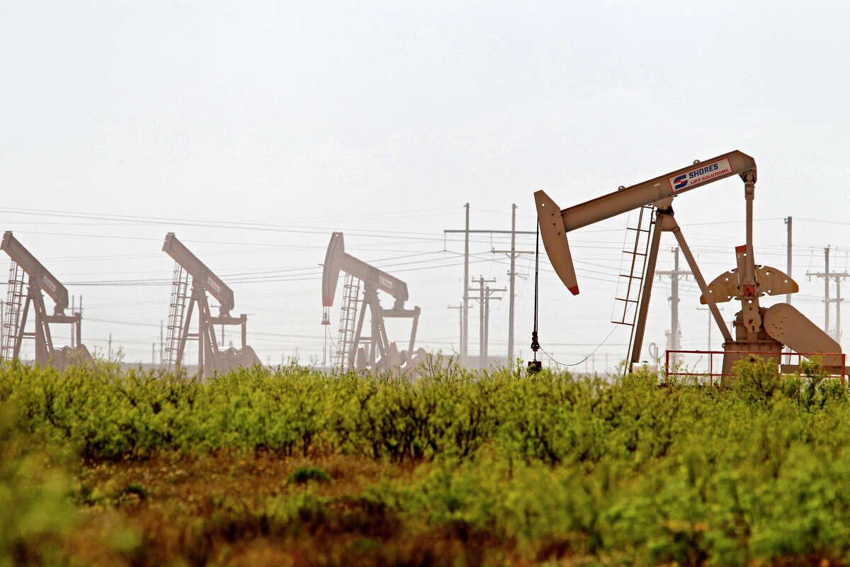 In this April 17, 2019, photo pumpjacks operate near a Diamondback oil and gas operation in Midland County.