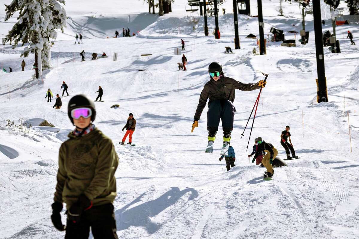 A skier jumps over a small hill during the opening day of the ski season at Boreal resort in Truckee, Calif. on November 11, 2022. Forecasters expect the first big storm of the season on Wednesday.
