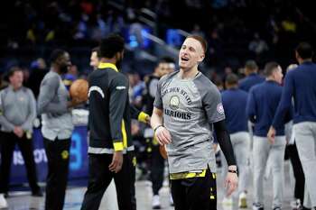 Golden State Warriors guard Jordan Poole throws out the ceremonial first  pitch before a baseball game between the San Francisco Giants and Atlanta  Braves, Sunday, Sept. 19, 2021, in San Francisco. (AP