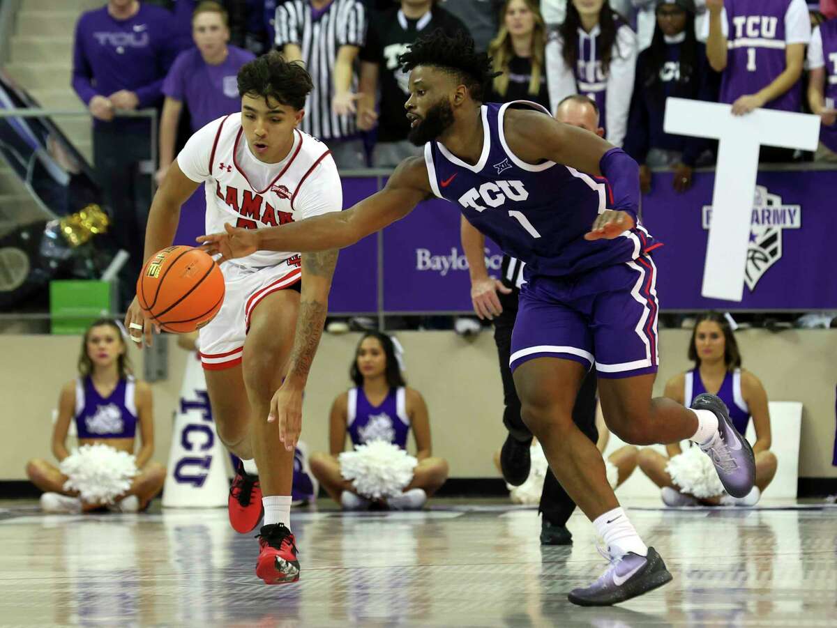 Lamar guard Cody Pennebaker (0) tips the ball away from TCU guard Mike Miles Jr. (1) in the second half during an NCAA college basketball game Friday, Nov. 11 2022, in Fort Worth, Texas.