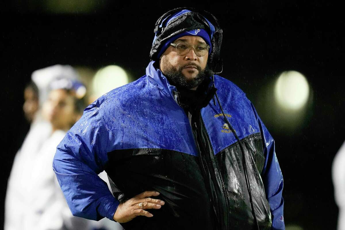 Channelview head coach Averion Hurts watches from the sideline during a Region III-6A Division II bi-district high school football playoff game against C.E. King, Friday, Nov. 11, 2022, in Channelview.