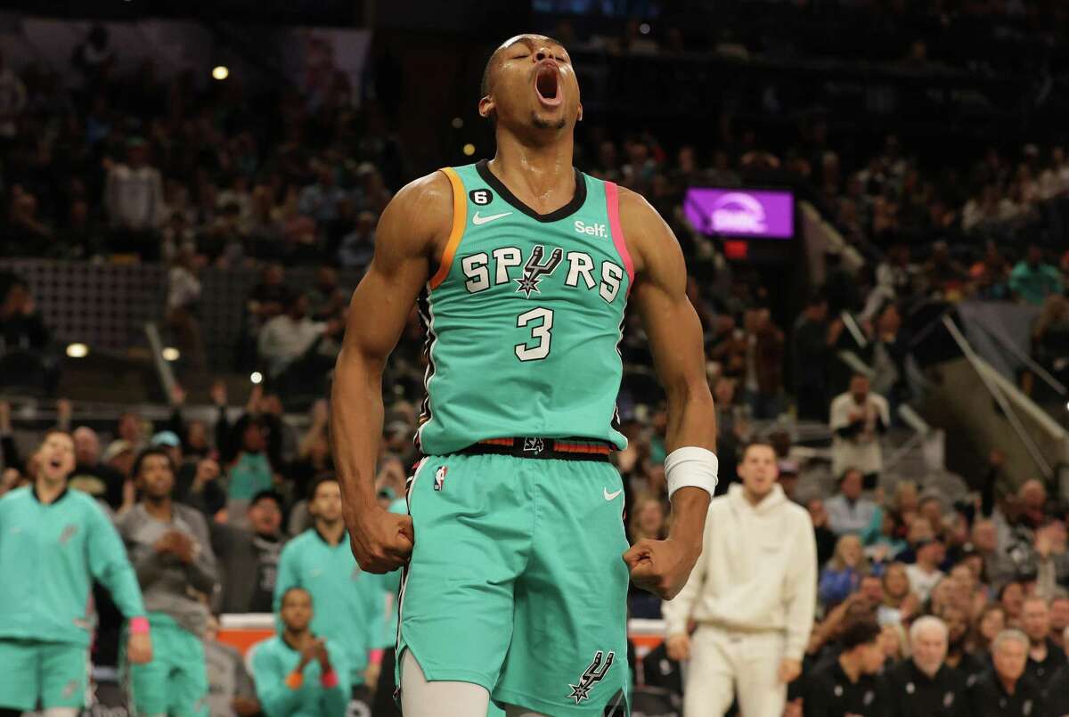 Spurs’ Keldon Johnson (03) reacts after a score on a foul against the Milwaukee Bucks in the 4th quarter at the AT&T Center on Friday, Nov. 11, 2022. Spurs defeated the Bucks, 111-93.