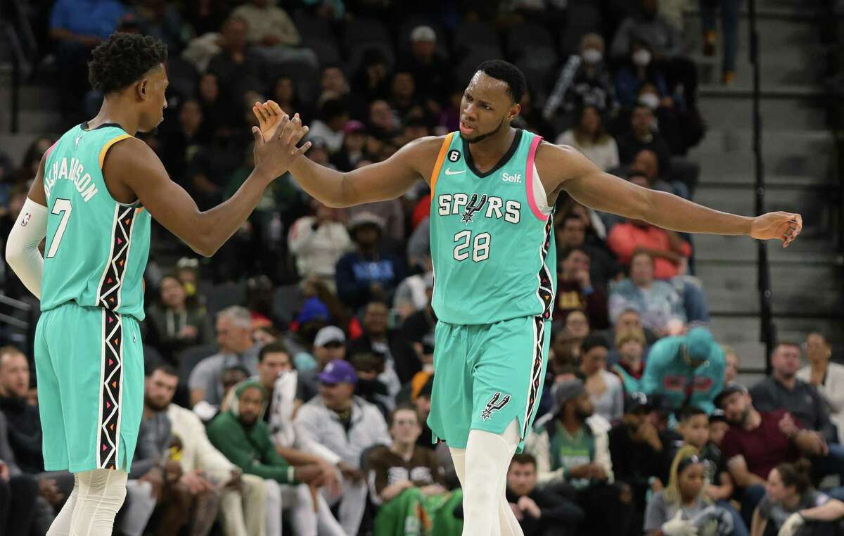 Spurs’ Charles Bassey (28) high-fives with Josh Richardson (07) during their game against the Milwaukee Bucks at the AT&T Center on Friday, Nov. 11, 2022. Spurs defeated the Bucks, 111-93.