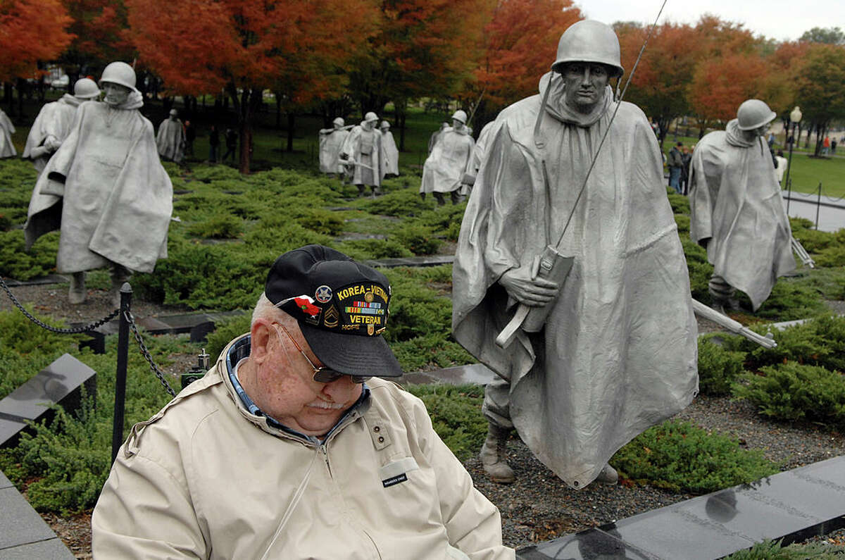 UNITED STATES - NOVEMBER 12, 2007: Allen S. McKenzie, of Texas, a veteran of the Korean and Vietnam Wars visits the Korean War Memorial, on Monday, the federal observation of Veteran's Day.