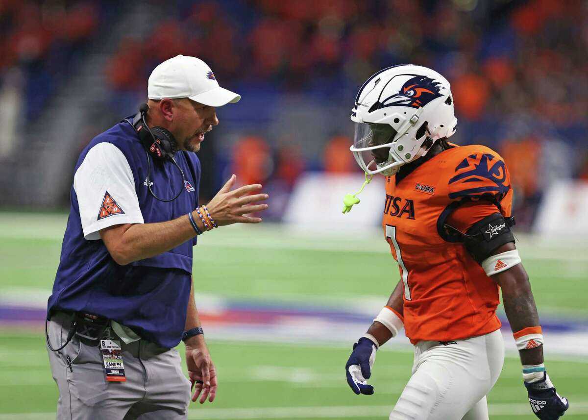 UTSA head coach Jeff Traylor gives instructions to linebacker Dadrian Taylor (7) as he comes off the field during the NCAA Conference USA football game against North Texas Saturday, Oct. 22, 2022, at the Alamodome in San Antonio, Texas.