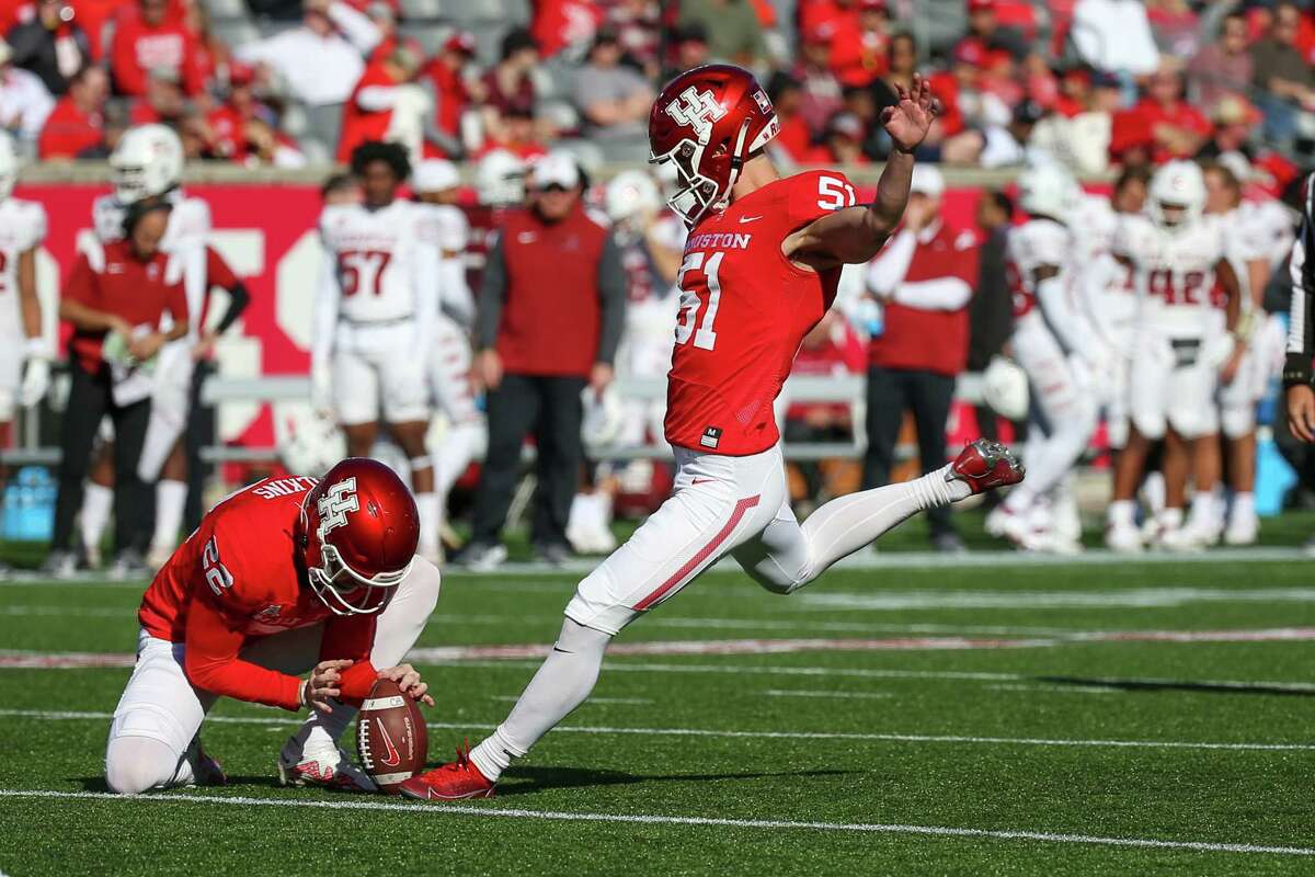 HOUSTON, TX NOV 12: Houston Cougars place kicker Kyle Ramsey (51) kicks for the extra point in the second quarter during the college football game between the Temple Owls and Houston Cougars at TDECU Stadium in Houston, Texas.