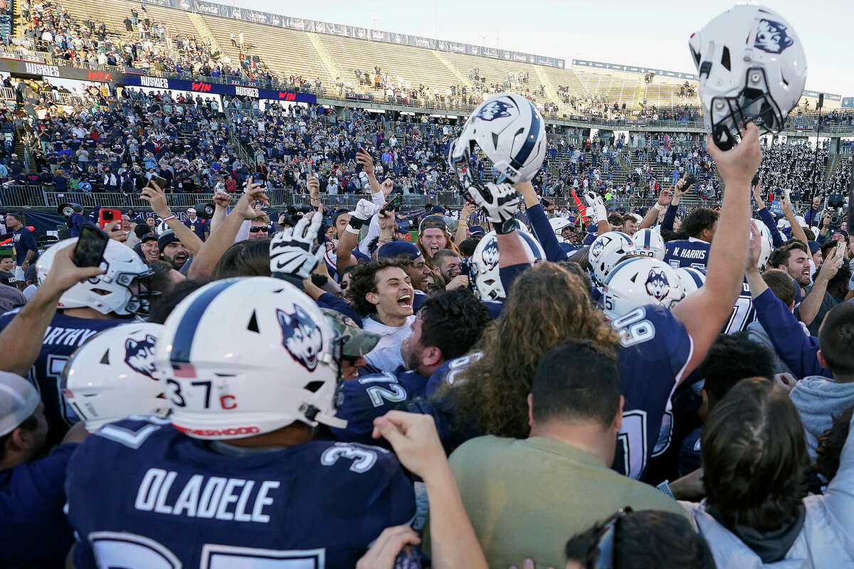 UConn football upsets Liberty for sixth win of season.